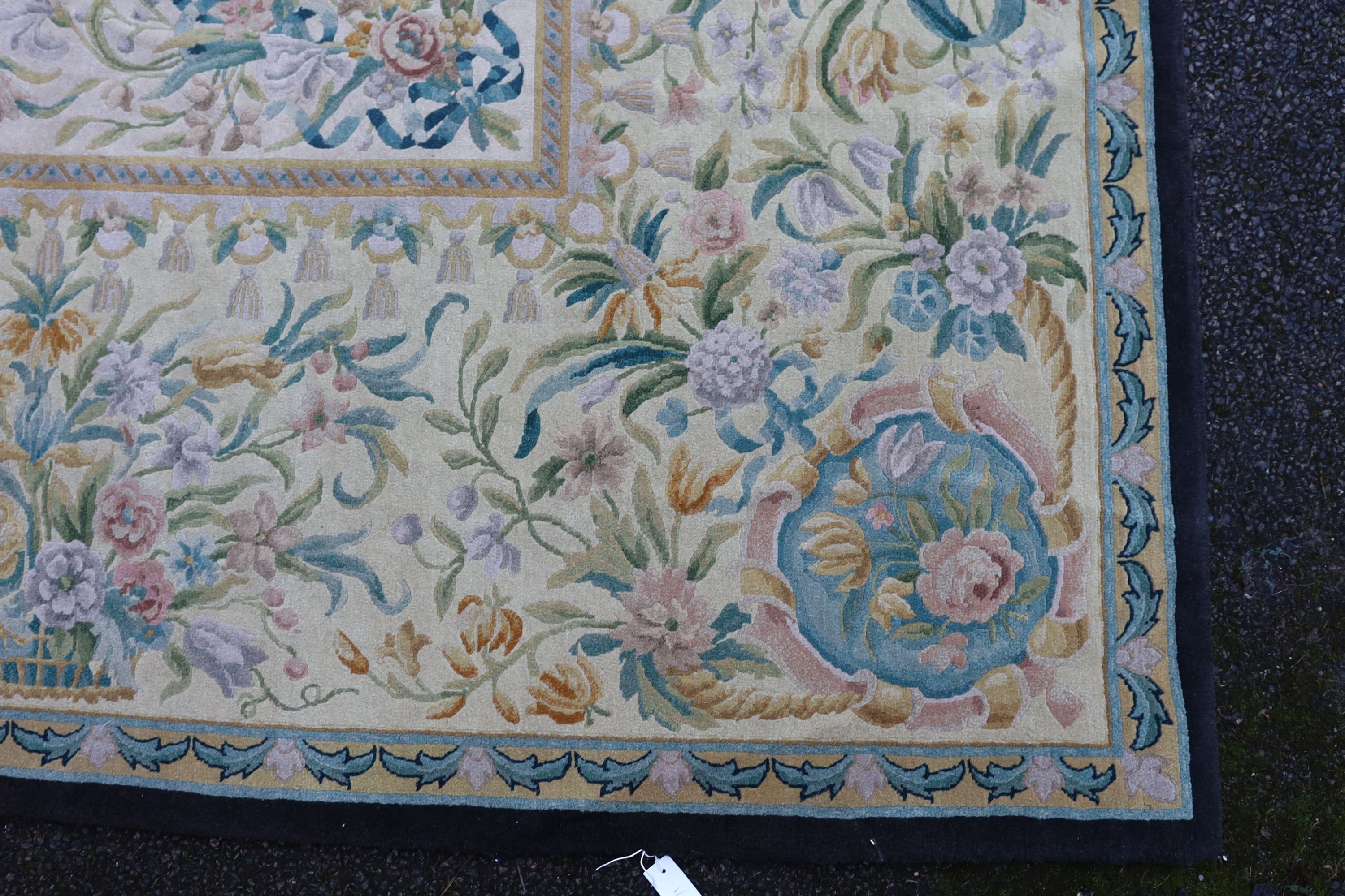 An Aubusson style ivory ground carpet, 372 x 274cm.